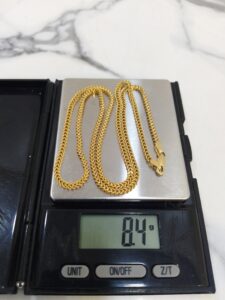 8.4g 18K yellow gold Franco chain necklace on a weighing scale