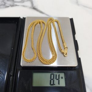 8.4g 18K yellow gold Franco chain necklace on a weighing scale