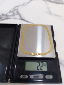 2.2g 18K yellow gold carpet chain bracelet on a scale