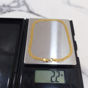 2.2g 18K yellow gold carpet chain bracelet on a scale