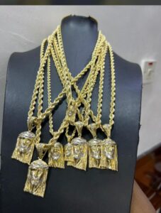 Best Gold Vendor in Nigeria; 18K solid yellow gold rope chains with two-tone Jesus piece pendants displayed at MK Gold in Lagos Nigeria.
