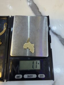 18 Karat Gold Africa Pendant (1.1g)